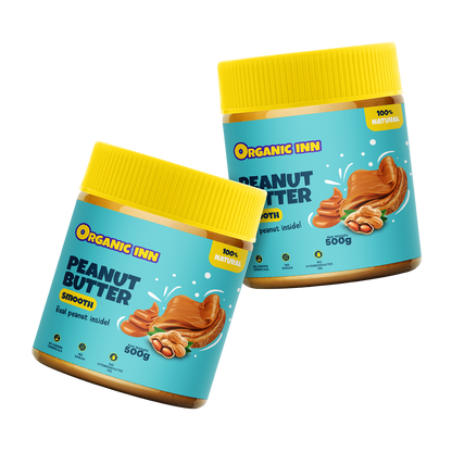 Two jars of Organic Inn peanut butter on a white background